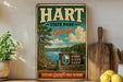 A vintage-style metal sign for Hart State Park in Georgia, featuring a scenic landscape with a lake and pine trees.