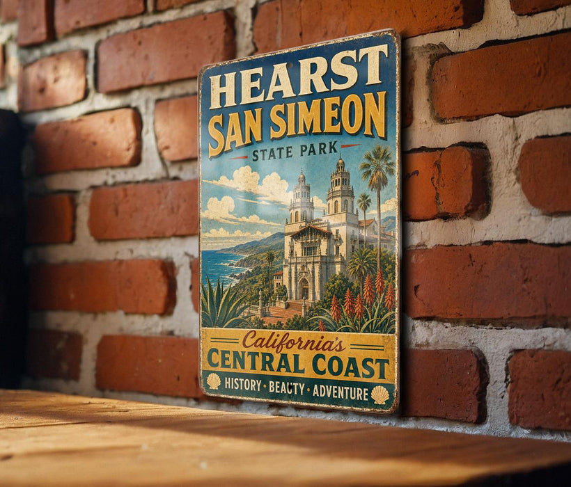 A vintage-style sign for Hearst San Simeon State Park, featuring a scenic illustration of the park's architecture and surrounding landscape.