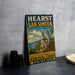 A vintage-style sign for Hearst San Simeon State Park, featuring an illustration of a coastal landscape with a church and palm trees.