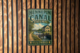 A vintage metal sign for Hennepin Canal State Park in Illinois, featuring a scenic illustration of the canal and surrounding landscape.