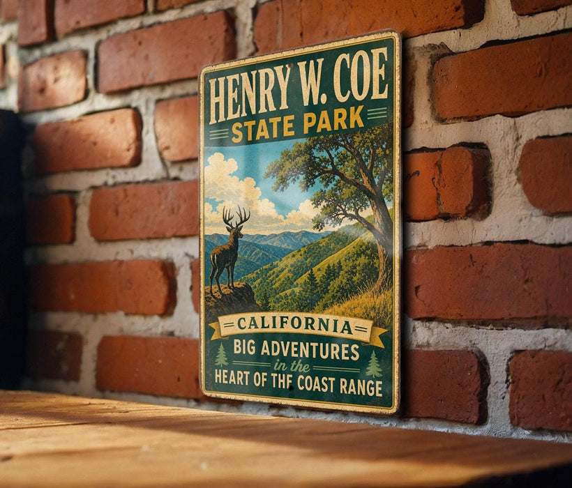 A vintage-style metal sign for Henry W. Coe State Park, featuring a scenic mountain landscape with a deer.