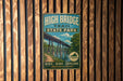 A vintage-style metal sign for High Bridge Trail State Park, featuring a bridge and a scenic landscape.