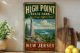A vintage-style sign for High Point State Park in New Jersey, featuring a scenic image of the park and a mountain.