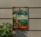 A vintage-style metal sign for High Point State Park in New Jersey, featuring a scenic landscape with a tall monument and a river.