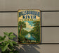 A vintage metal sign for Hillsborough River State Park in Florida, featuring a palm tree and a bird, is displayed on a wall.