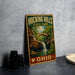 A vintage-style metal sign for Hocking Hills State Park in Ohio, featuring a scenic image of a waterfall and a bridge.
