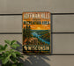 A vintage metal sign for Hoffman Hills State Recreation Area in Wisconsin, featuring a scenic landscape with a river, mountains, and trees.