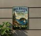A vintage-style metal sign for Holbrook Island State Park in Maine, featuring a scenic illustration of a lake, mountains, and a sailboat.