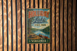 A vintage metal sign for Holliday Lake State Park in Virginia, featuring a scenic image of a lake with a canoe and picnic table.