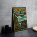 A vintage-style sign for Honey Creek State Park in Oklahoma, featuring a scenic landscape with a lake and mountains.