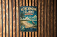 A vintage-style metal sign for Honeymoon Island State Park, Florida, featuring a beach scene with palm trees and a bird.