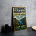 A vintage-style metal sign for Hudson Highlands State Park Preserve, featuring a scenic landscape with mountains, a river, and a boat.
