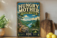 A vintage-style metal sign for Hungry Mother State Park, featuring a scenic mountain landscape with a winding river and pine trees.