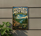A vintage-style metal sign for Hungry Mother State Park, featuring a scenic mountain landscape with a river and pine trees.