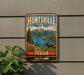 A vintage metal sign for Huntsville State Park, featuring a scenic landscape with mountains, a moose, and a lake.