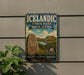 A vintage-style sign for Iceland State Park in North Dakota, featuring a scenic landscape with mountains, water, and a Viking ship.