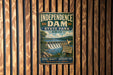 A vintage-style sign for Independence Dam, a state park in Ohio, featuring a scenic image of the dam and surrounding landscape.