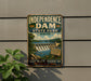 A vintage-style metal sign for Independence Dam, a state park in Ohio, featuring a scenic image of the dam and surrounding landscape.