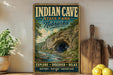 A vintage-style poster advertising Indian Cave State Park in Nebraska, featuring a scenic illustration of the cave surrounded by lush greenery and a river.