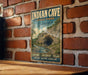 A vintage-style metal sign for the Indian Cave State Park in Nebraska, featuring a scenic illustration of the cave and its surroundings.