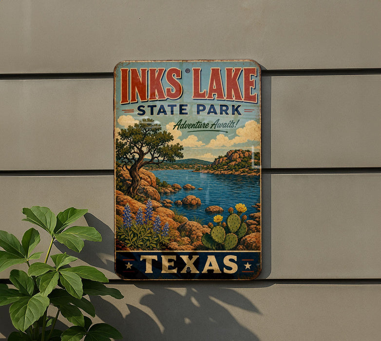 A vintage-style sign for Inks Lake State Park in Texas, featuring a scenic landscape with a lake, mountains, and cacti.