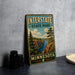 A vintage metal sign for Interstate State Park in Minnesota, featuring a scenic landscape with pine trees, cliffs, and a river.