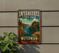 A vintage-style metal sign for Interstate State Park in Wisconsin, featuring a scenic landscape with a river and mountains.
