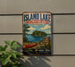 A vintage-style metal sign for the Island Lake Recreation Area in Michigan, featuring a canoe and a scenic landscape.