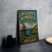 A vintage-style metal sign for the Jackson E. Kimball State Recreation Site in Oregon, featuring a scenic landscape with a mountain, lake, and pine trees.