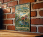A vintage-style sign for the Environmental Education Center in Pennsylvania, featuring a bridge and a heron in a natural setting.