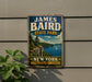 A vintage-style metal sign for James Baird State Park in New York, featuring a scenic landscape with a lake, mountains, and a sailboat.