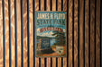 A vintage-style metal sign for James H. Floyd State Park in Georgia, featuring a scenic landscape with pine trees and a lake.