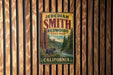 A vintage-style metal sign for JEDEDIAH SMITH REDWOODS STATE PARK in California, featuring a bear and a scenic landscape.