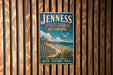 A vintage-style metal sign for Jenness State Beach in New Hampshire, featuring a beach scene with a bird and a house.