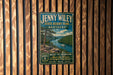A vintage-style metal sign for Jenny Wiley State Resort Park in Kentucky, featuring a scenic image of a river and mountains.