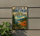 A vintage-style metal sign for Jessie M. Honeyman Memorial State Park in Oregon, featuring a scenic landscape with mountains, trees, and a beach.