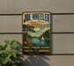 A vintage-style sign for Joe Wheeler State Park in Alabama, featuring a scenic landscape with a lake, trees, and a sailboat.