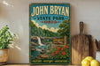 A vintage-style sign for John Bryan State Park in Ohio, featuring a scenic landscape with a waterfall and lush greenery.