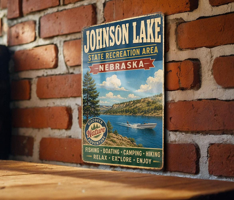 A vintage-style sign for Johnson Lake, the state recreation area in Nebraska, featuring a scenic image of a lake and mountains.