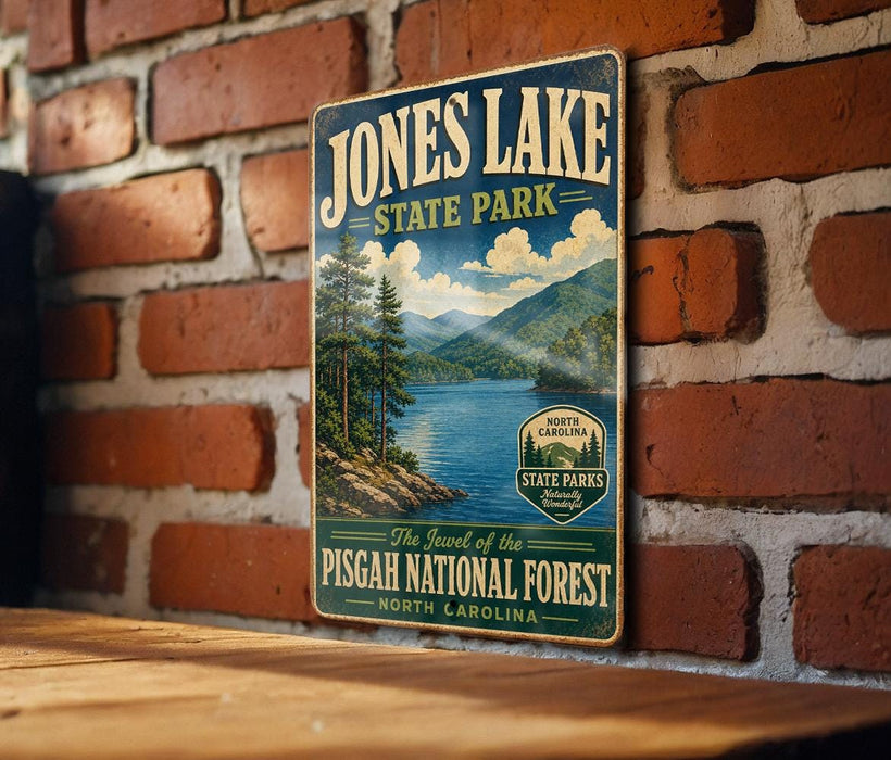 A vintage-style metal sign for Jones Lake State Park, featuring a scenic landscape with pine trees, mountains, and a lake.
