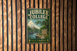 A vintage metal sign for Jubilee College State Park in Illinois, featuring a scenic landscape with a river and trees.