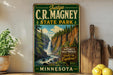 A vintage-style sign for C.R. Magney State Park in Minnesota, featuring a scenic image of a waterfall surrounded by pine trees.