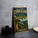 A vintage-style metal sign for the Cumberland Trail in Tennessee, featuring a scenic landscape with a winding path and a river.