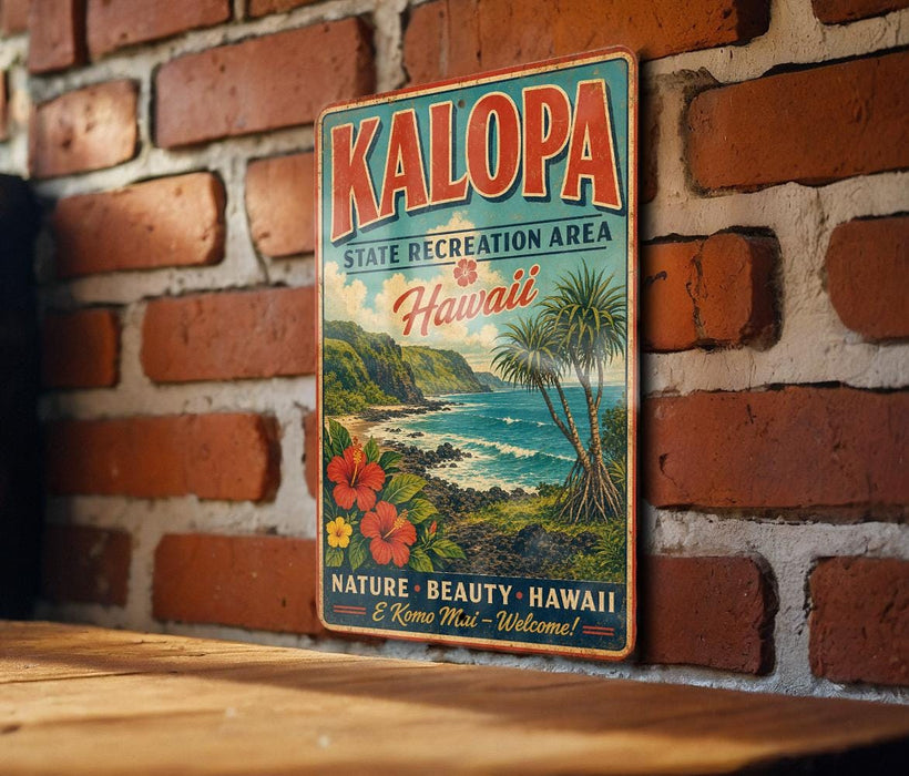 A vintage metal sign for the Kalapa State Recreation Area in Hawaii, featuring a tropical beach scene with palm trees, flowers, and the ocean.