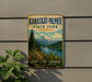A vintage-style metal sign for Kanaskat-Palmer State Park in Washington, featuring a scenic mountain landscape and a path leading to a lake.