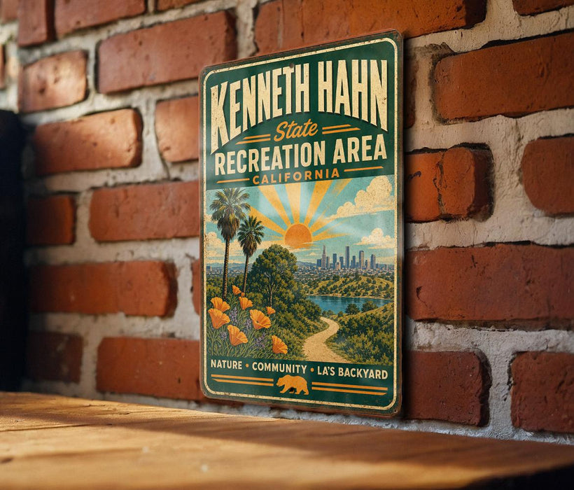 A vintage-style metal sign for the Kenneth Hahn State Recreation Area in California, featuring a scenic illustration of a nature trail, a city skyline, and a sunset.