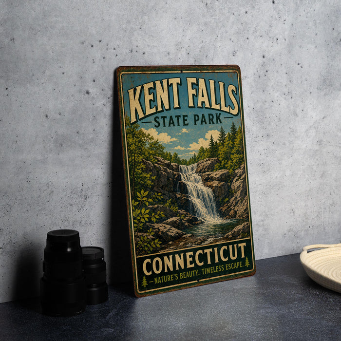 A vintage-style sign for Kent Falls State Park in Connecticut, featuring a scenic illustration of a waterfall surrounded by lush greenery.