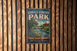 A vintage metal sign for Kerrville-Schreiner Park in Texas, featuring a scenic illustration of a river, bridge, and surrounding landscape.