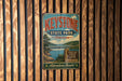 A vintage-style metal sign for Keystone State Park in Oklahoma, featuring a scenic landscape with a bridge and water.