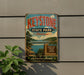 A vintage-style metal sign for Keysstone State Park in Oklahoma, featuring a scenic landscape with a lake, bridge, and mountains.